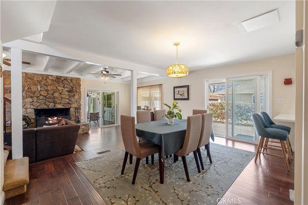 Dining room, Fireplace, Interior, Living room, Pendant Lights, Stone Walls, Wood Texture Flooring