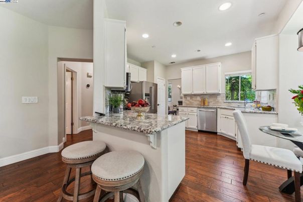 Dining room, Interior, Kitchen, Recessed Lighting, Stainless Steel Appliances, Wood Texture Flooring