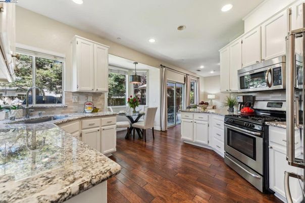 Dining room, Interior, Kitchen, Recessed Lighting, Stainless Steel Appliances, Wood Texture Flooring