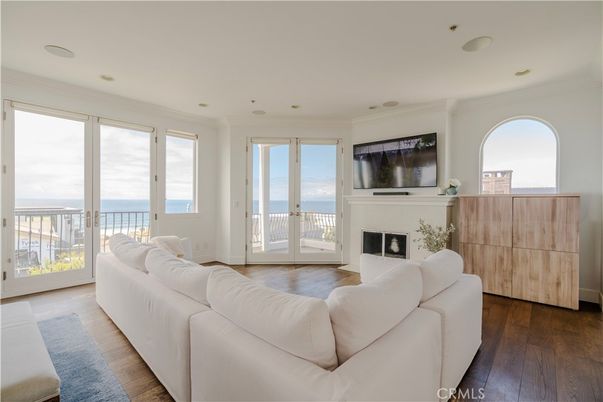 Fireplace, Interior, Living room, Recessed Lighting, Water, Wood Texture Flooring