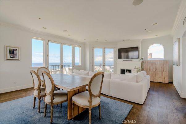 Dining room, Fireplace, Interior, Living room, Recessed Lighting, Water, Wood Texture Flooring
