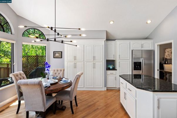 Dining room, Interior, Kitchen, Pendant Lights, Recessed Lighting, Stainless Steel Appliances, Wood Texture Flooring