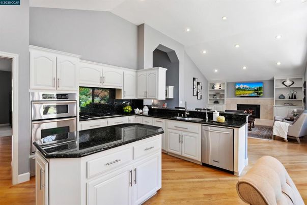 Fireplace, Interior, Kitchen, Living room, Recessed Lighting, Wood Texture Flooring