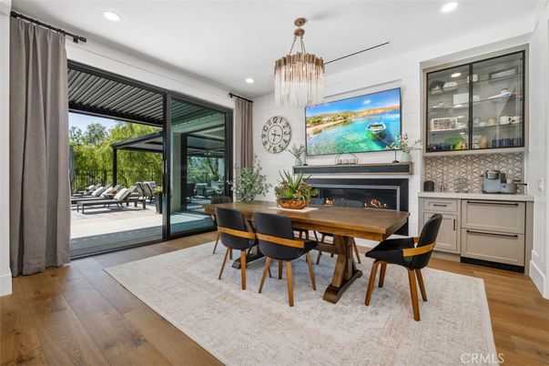 Chandelier, Dining room, Fireplace, Interior, Recessed Lighting, Wood Texture Flooring