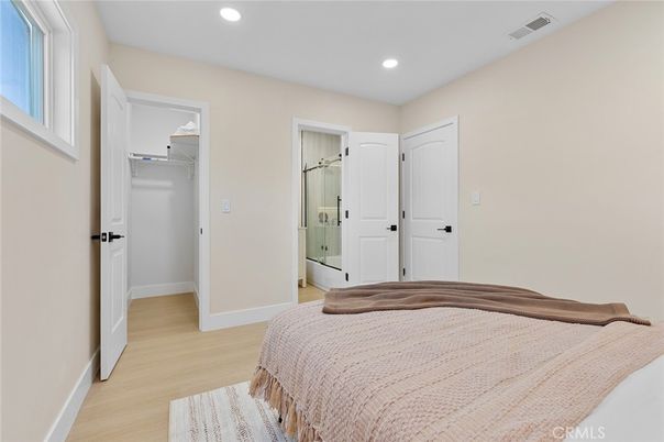 Bathroom, Bedroom, Glass Shower, Interior, Recessed Lighting, Wood Texture Flooring