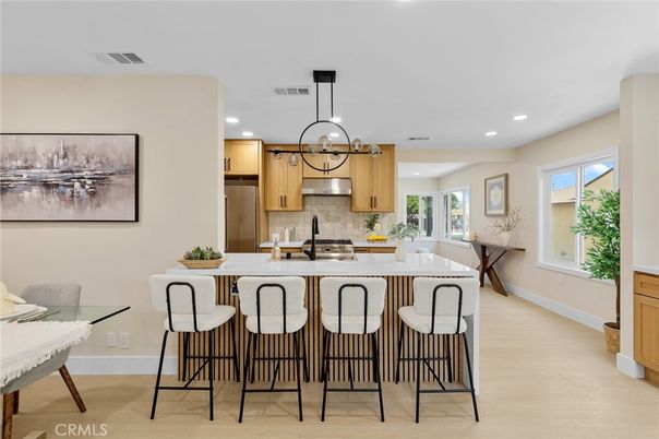 Dining room, Interior, Kitchen, Pendant Lights, Recessed Lighting, Stainless Steel Appliances, Wood Texture Flooring