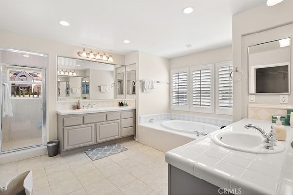 Bathroom, Dual Sink Vanities, Glass Shower, Interior, Recessed Lighting, Tile Countertops