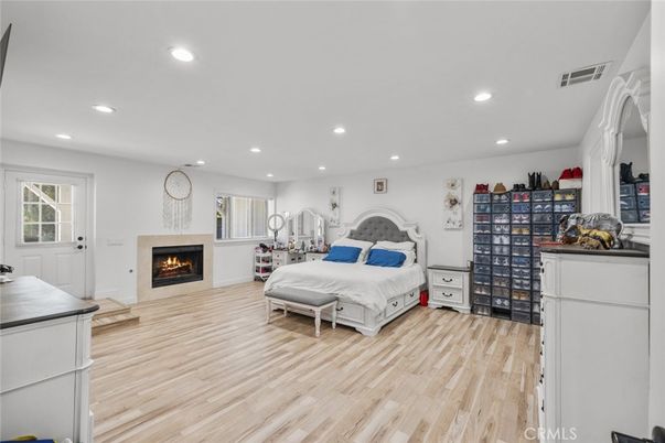Bedroom, Fireplace, Interior, Recessed Lighting, Wood Texture Flooring