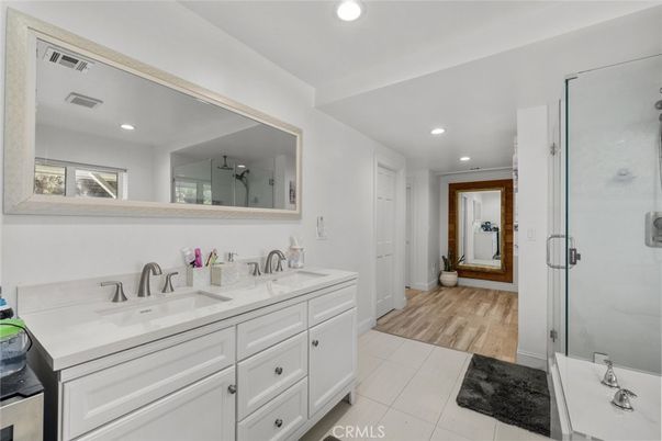 Bathroom, Dual Sink Vanities, Glass Shower, Interior, Recessed Lighting, Wood Texture Flooring