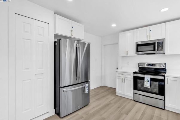 Interior, Kitchen, Recessed Lighting, Stainless Steel Appliances, Wood Texture Flooring