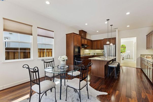 Dining room, Interior, Kitchen, Pendant Lights, Recessed Lighting, Stainless Steel Appliances, Wood Texture Flooring