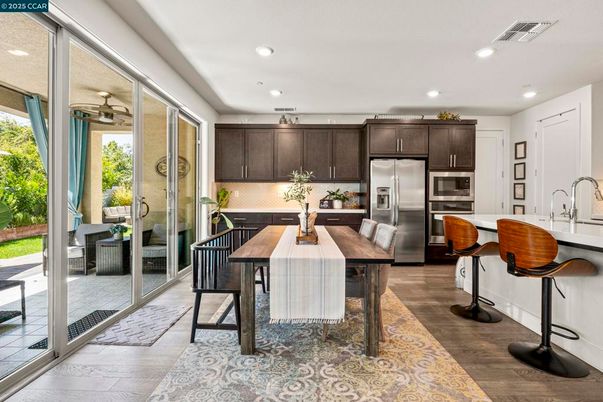 Dining room, Interior, Kitchen, Recessed Lighting, Stainless Steel Appliances, Wood Texture Flooring