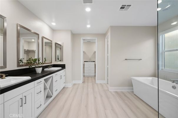Bathroom, Dual Sink Vanities, Free Standing Baths, Interior, Recessed Lighting, Wood Texture Flooring