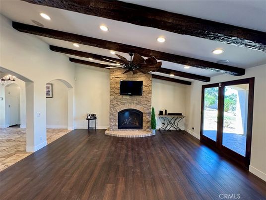 Empty room, Fireplace, Interior, Recessed Lighting, Stone Walls, Wooden Beams, Wood Texture Flooring