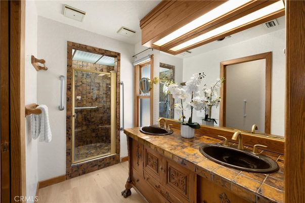 Bathroom, Dual Sink Vanities, Glass Shower, Interior, Tile Countertops, Wood Texture Flooring