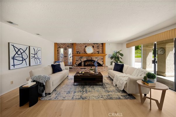 Fireplace, Interior, Living room, Recessed Lighting, Stone Walls, Wood Texture Flooring