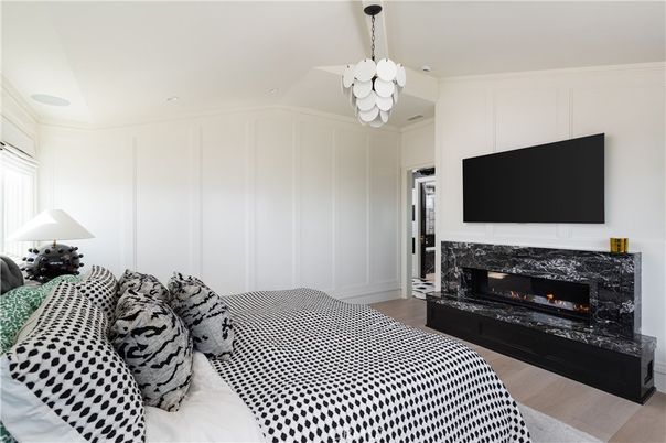 Bedroom, Chandelier, Fireplace, Interior, Pendant Lights, Recessed Lighting, Wood Texture Flooring