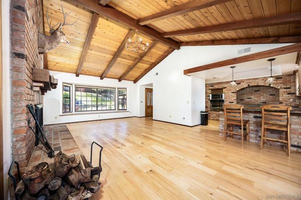 Chandelier, Empty room, Fireplace, Interior, Stone Walls, Wooden Beams, Wooden Ceilings, Wood Texture Flooring
