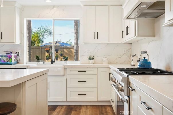 Interior, Kitchen, Marble Walls, Recessed Lighting, Stainless Steel Appliances, Wood Texture Flooring