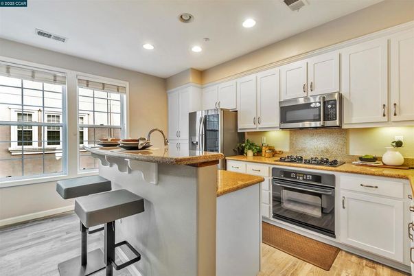 Interior, Kitchen, Recessed Lighting, Stainless Steel Appliances, Wood Texture Flooring