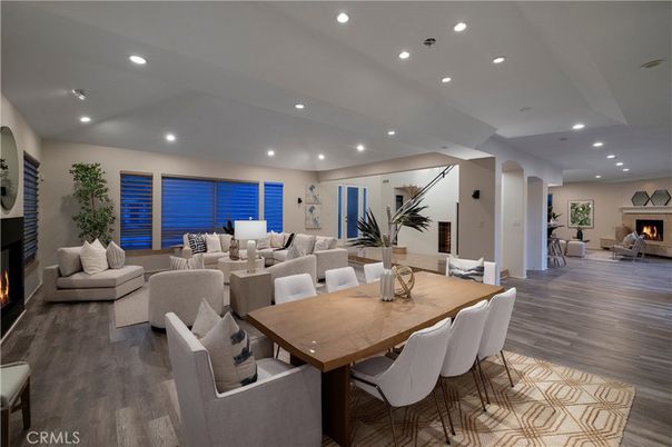 Dining room, Fireplace, Interior, Living room, Recessed Lighting, Wood Texture Flooring