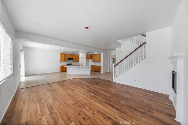 Empty room, Fireplace, Interior, Kitchen, Recessed Lighting, Wood Texture Flooring