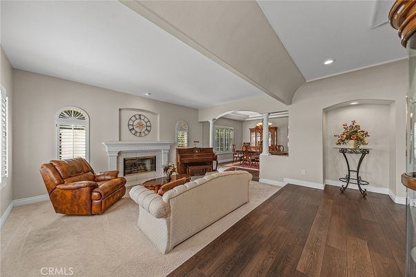 Dining room, Fireplace, Interior, Living room, Piano, Recessed Lighting, Wood Texture Flooring