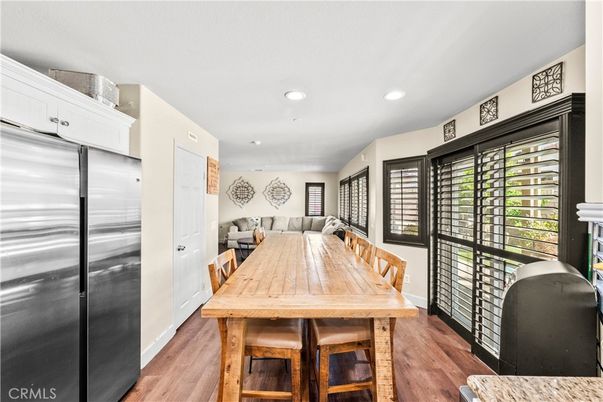 Dining room, Interior, Kitchen, Living room, Recessed Lighting, Stainless Steel Appliances, Wood Texture Flooring