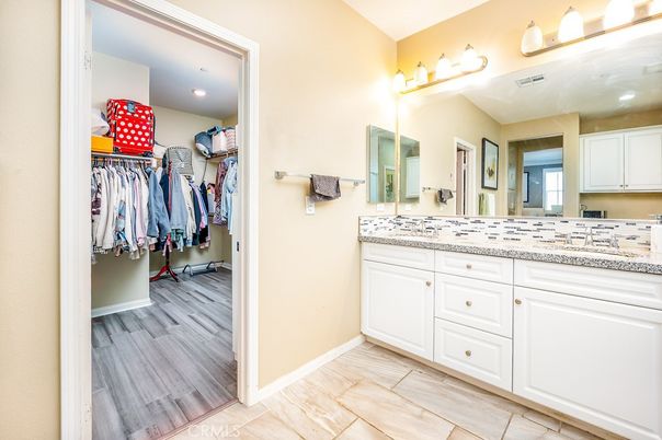 Bathroom, Dual Sink Vanities, Interior, Recessed Lighting, Walk-in Closets, Wood Texture Flooring