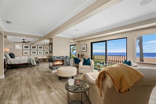 Bedroom, Fireplace, Interior, Living room, Recessed Lighting, Water, Wood Texture Flooring