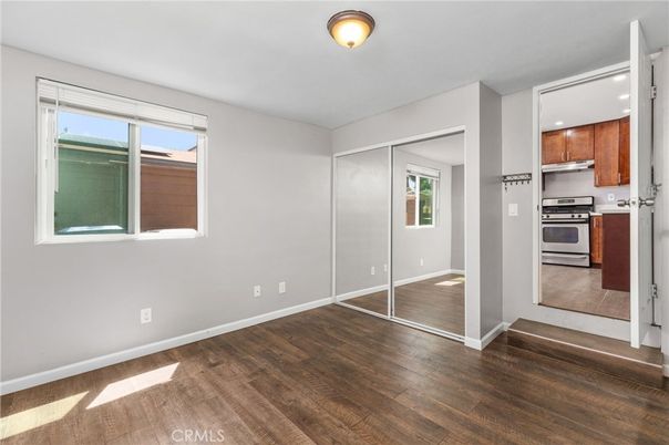 Empty room, Interior, Kitchen, Stainless Steel Appliances, Wood Texture Flooring