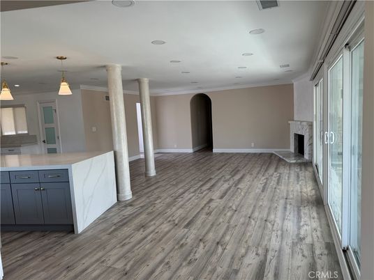 Empty room, Fireplace, Interior, Kitchen, Pendant Lights, Recessed Lighting, Wood Texture Flooring