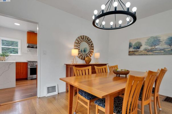 Chandelier, Dining room, Interior, Kitchen, Pendant Lights, Recessed Lighting, Stainless Steel Appliances, Wood Texture Flooring