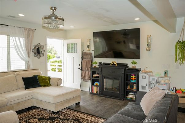 Chandelier, Fireplace, Interior, Living room, Recessed Lighting, Wood Texture Flooring