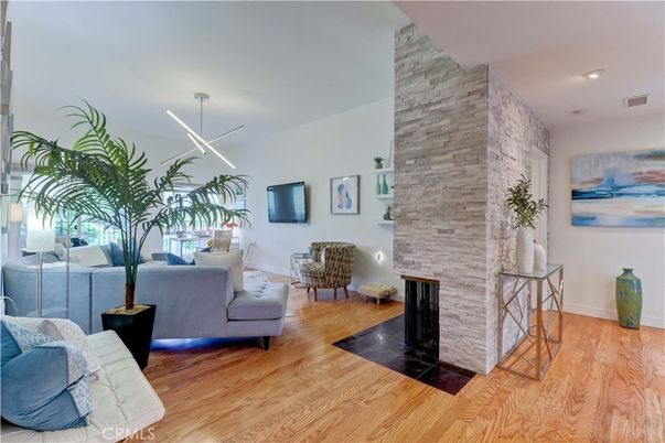 Fireplace, Interior, Living room, Pendant Lights, Recessed Lighting, Stone Walls, Wood Texture Flooring