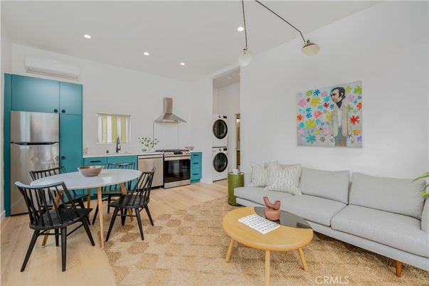 Dining room, Interior, Kitchen, Living room, Pendant Lights, Recessed Lighting, Stainless Steel Appliances, Washer, Wood Texture Flooring