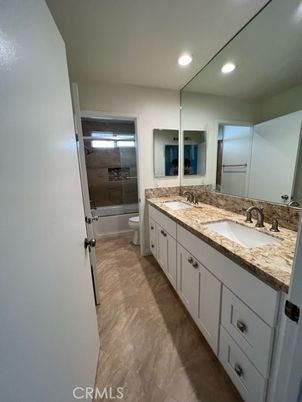 Bathroom, Dual Sink Vanities, Interior, Recessed Lighting, Wood Texture Flooring