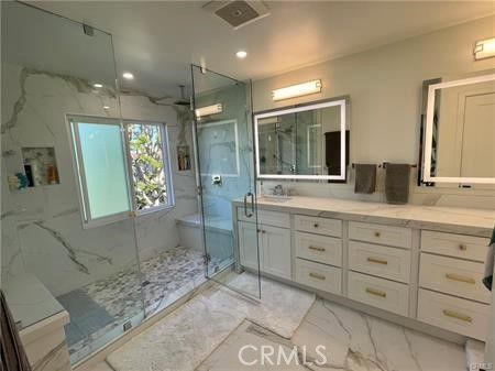 Bathroom, Dual Sink Vanities, Glass Shower, Interior, Marble, Marble Walls, Recessed Lighting
