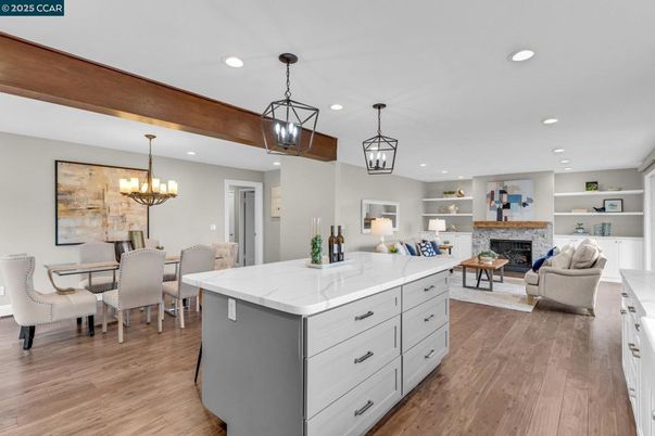 Chandelier, Dining room, Fireplace, Interior, Living room, Pendant Lights, Recessed Lighting, Wooden Beams, Wood Texture Flooring