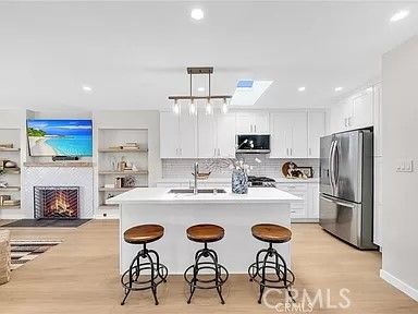 Fireplace, Interior, Kitchen, Pendant Lights, Recessed Lighting, Stainless Steel Appliances, Wood Texture Flooring