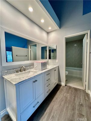 Bathroom, Dual Sink Vanities, Interior, Recessed Lighting, Wood Texture Flooring