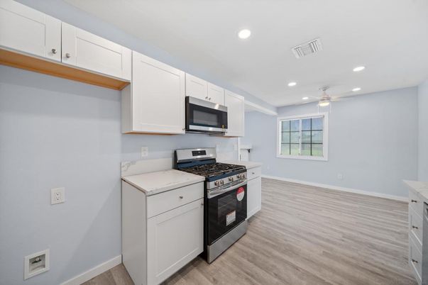 Interior, Kitchen, Recessed Lighting, Stainless Steel Appliances, Wood Texture Flooring