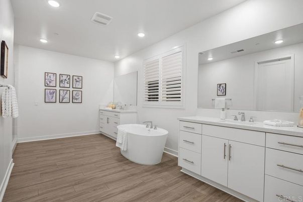 Bathroom, Dual Sink Vanities, Free Standing Baths, Interior, Recessed Lighting, Wood Texture Flooring