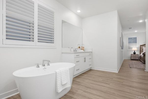 Bathroom, Dual Sink Vanities, Free Standing Baths, Interior, Recessed Lighting, Wood Texture Flooring