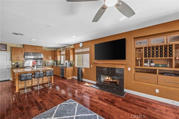 Fireplace, Interior, Kitchen, Recessed Lighting, Stainless Steel Appliances, Wood Texture Flooring