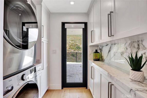 Interior, Marble Walls, Recessed Lighting, Washer, Wood Texture Flooring