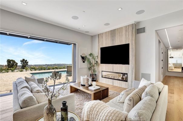 Fireplace, Interior, Living room, Recessed Lighting, Water, Wood Texture Flooring