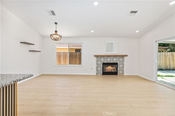 Empty room, Fireplace, Interior, Pendant Lights, Recessed Lighting, Wood Texture Flooring