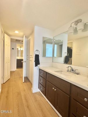 Bathroom, Dual Sink Vanities, Interior, Recessed Lighting, Wood Texture Flooring
