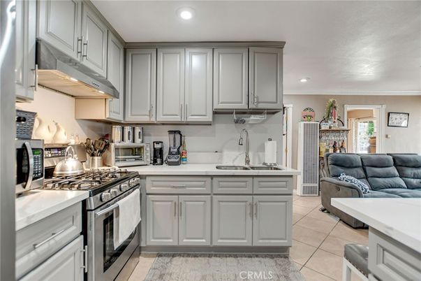 Fireplace, Interior, Kitchen, Living room, Recessed Lighting, Stainless Steel Appliances